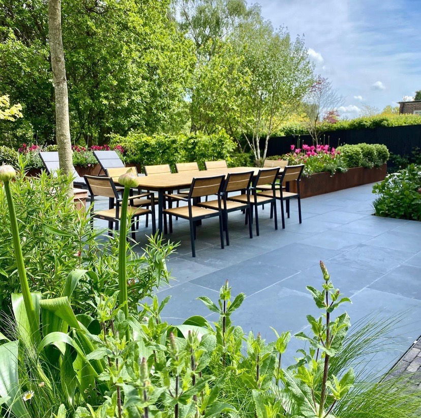 Beautiful garden design with table and chairs